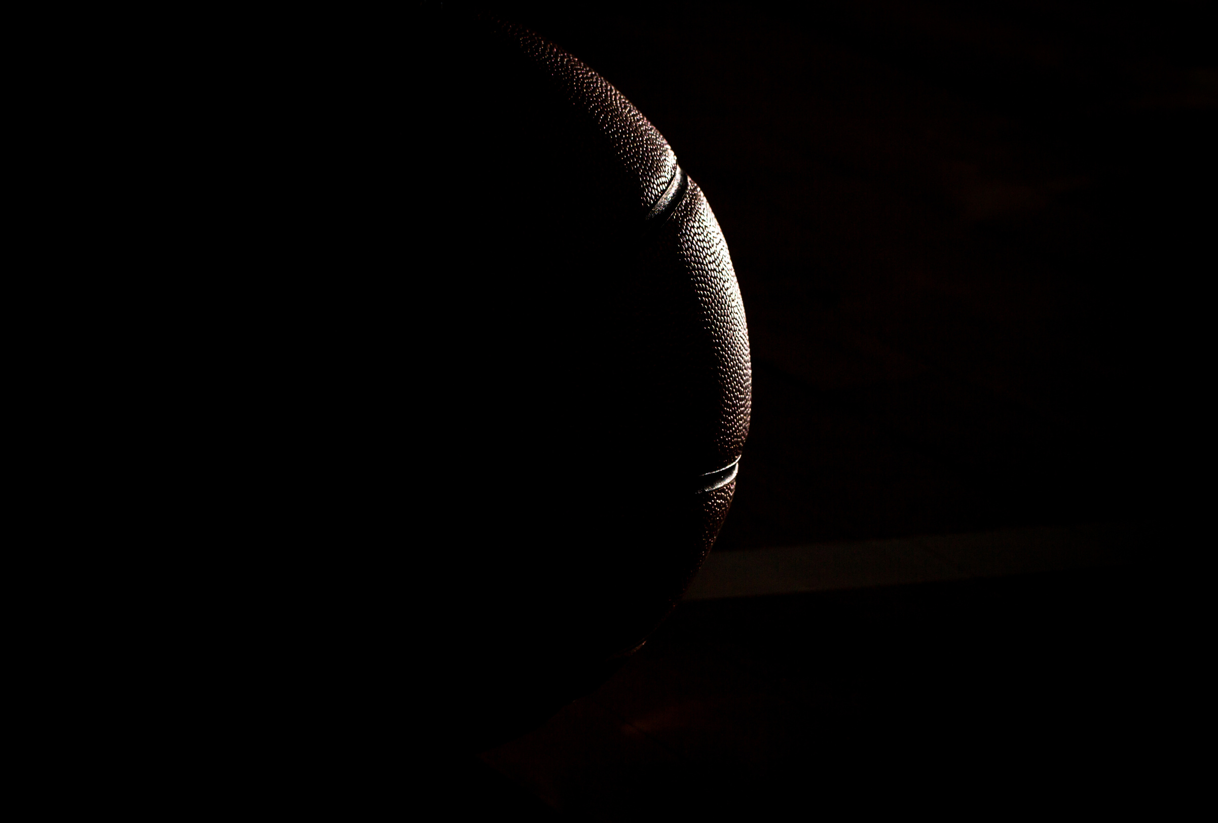 Basketball on court black background